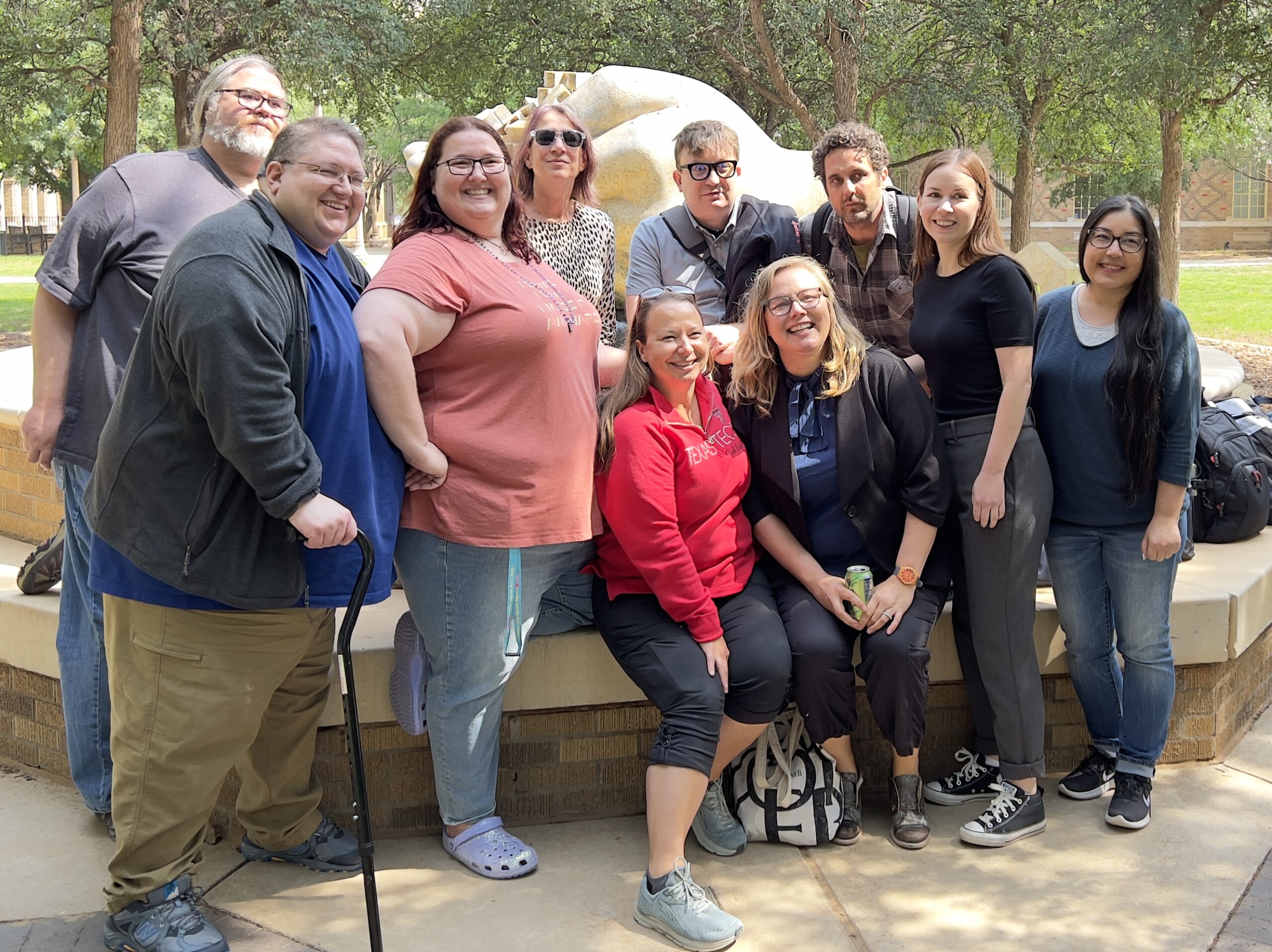 Technical Communication and Rhetoric in front of Headwaters sculpture
