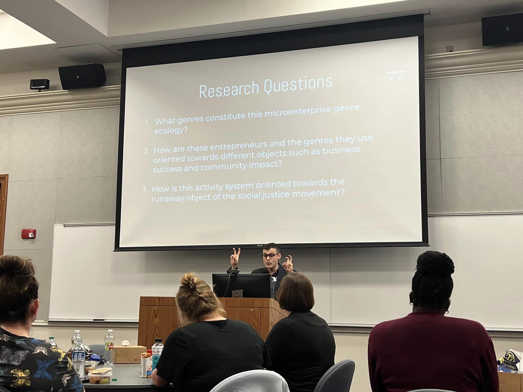 Dr. Mason Pelligrini giving a presentation to TCR students and faculty
