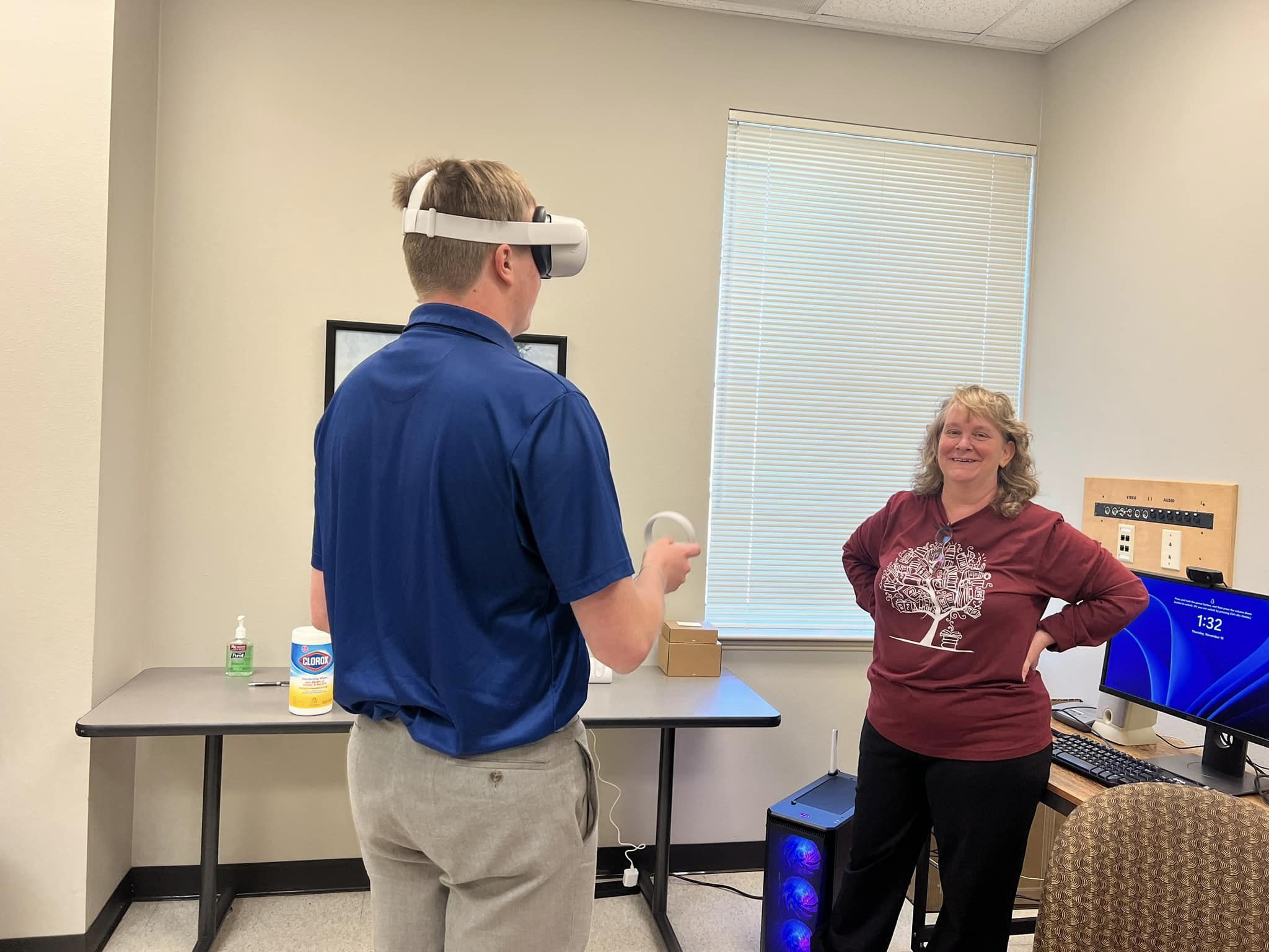 Assistant Professor of TCR, Dr. Lisa Phillips assists a student with VR technology